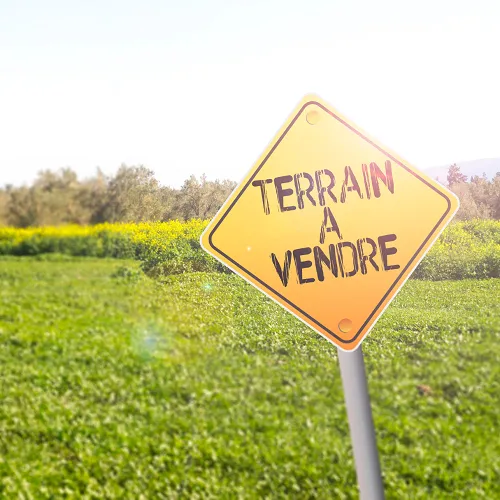 pancarte trouver un terrain à vendre